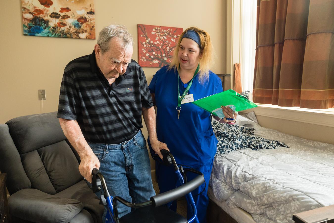 Patient with walker and nurse.