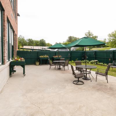 Outside patio with tables and chairs. 